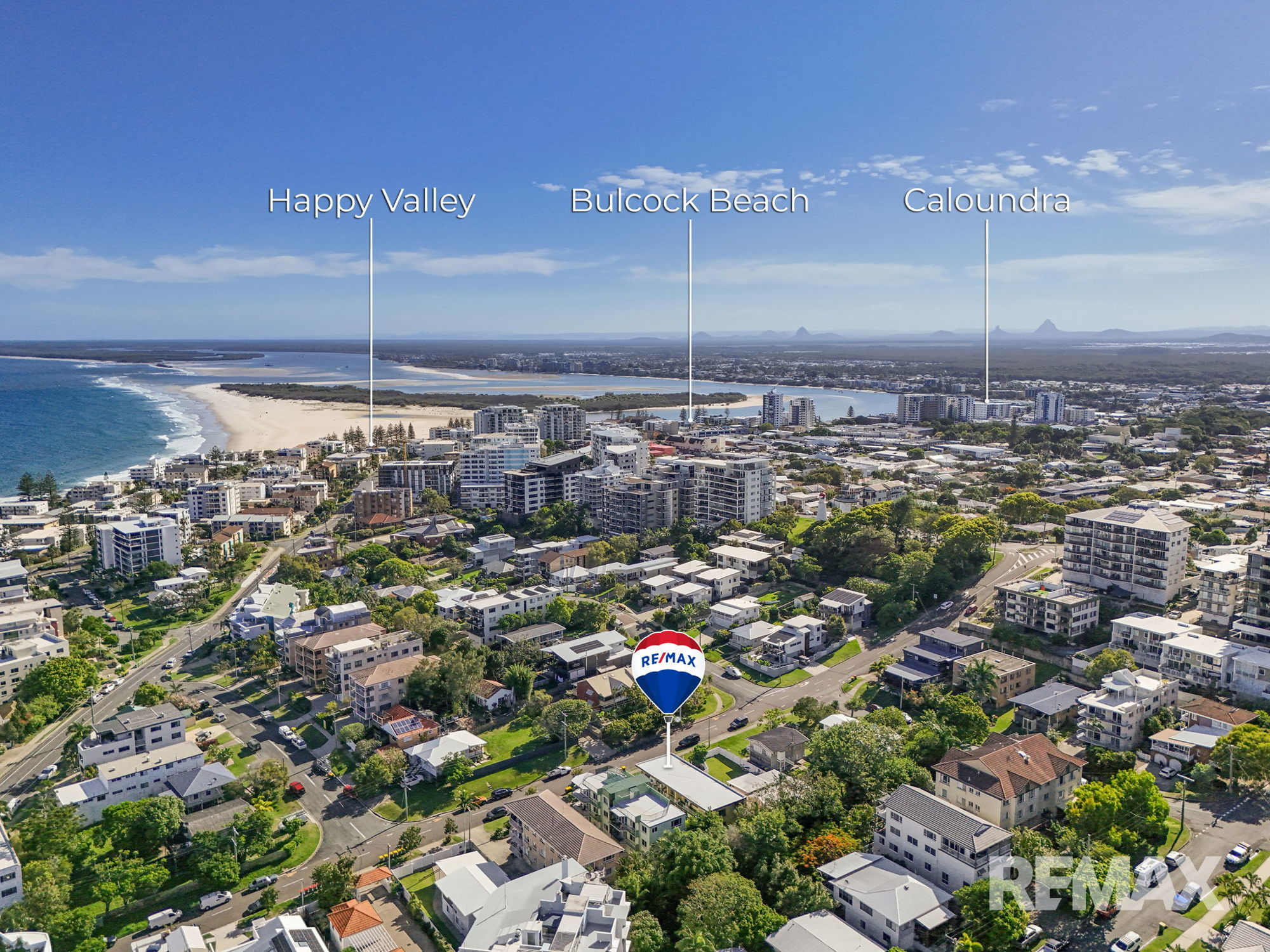 SPACIOUS BEACHSIDE UNIT WITH HUGE DECK & EXTRA-LARGE GARAGE