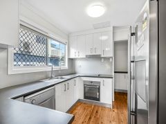 HIGH-SET HOME WITH MODERN UPDATES AND AIR-CONDITIONING