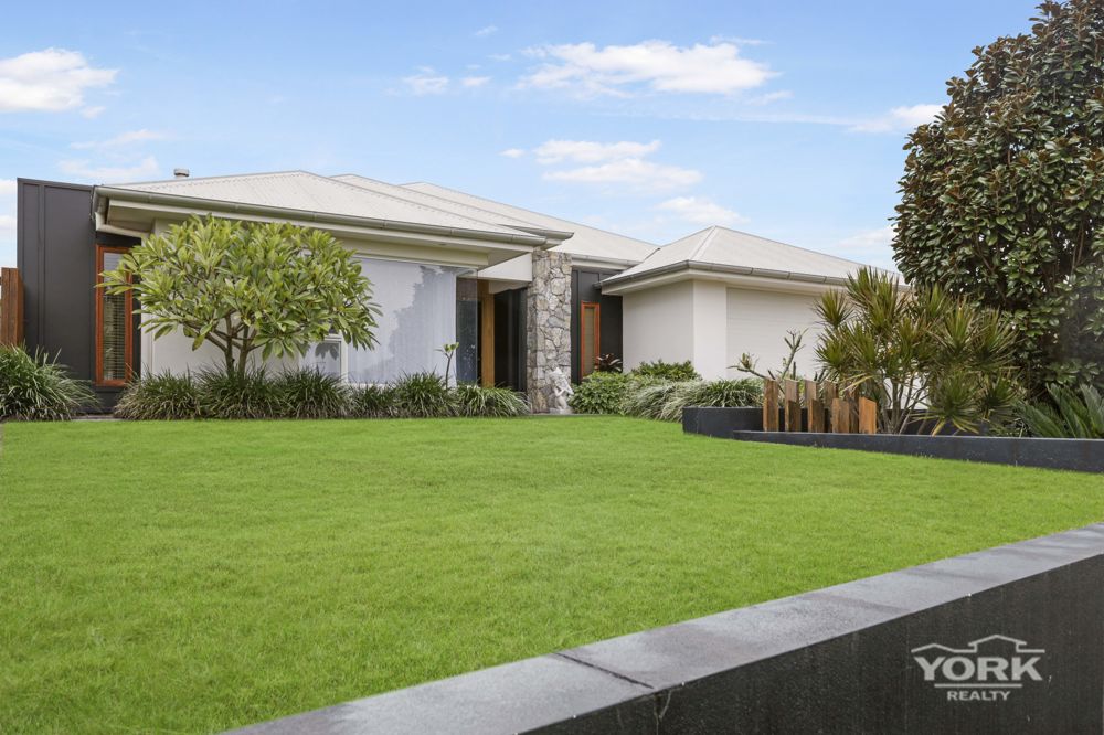A WARM AND WELCOMING FAMILY HOME WITH ELEVATED APPEAL