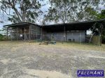INDUSTRIAL LAND WITH SHED & SECURITY FENCING