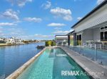 LUXURY LIVING WITH RESORT-STYLE POOL AND STUNNING CANAL OUTLOOK