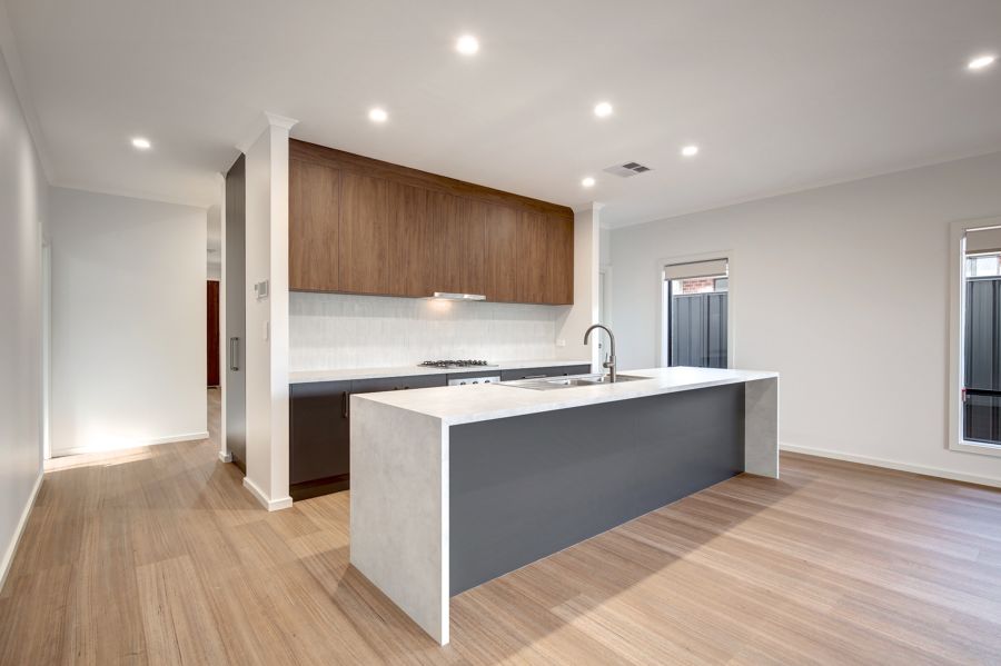 WELCOMING AND LIGHT FILLED, THIS SPACIOUS AND THOUGHTFULLY DESIGNED HOME IS SURE TO IMPRESS.