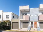 CONTEMPORARY TOWNHOME WITH NO BODY CORP.