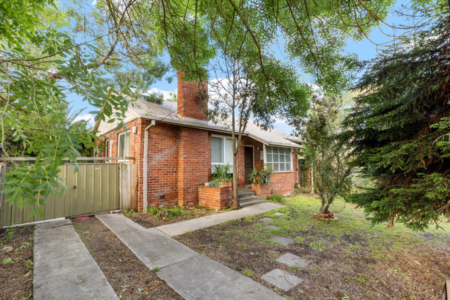 A CLASSIC, RED BRICK HOME ON LARGE BLOCK