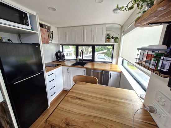 THIS 2 STOREY TINY HOME IS PACKED WITH FEATURES!