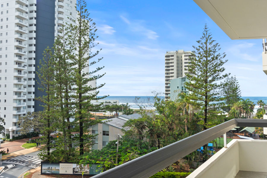 RENOVATED COASTAL RETREAT WITH OCEAN VIEWS IN BOUTIQUE BEACHSIDE BUILDING