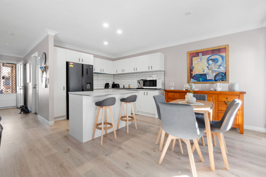 RENOVATED COASTAL TOWNHOUSE JUST MOMENTS FROM THE BROADWATER