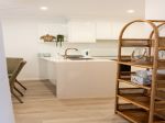 PICTURE PERFECT COASTAL DUPLEX WITH FILTERED WATER VIEWS BETWEEN THE TREES