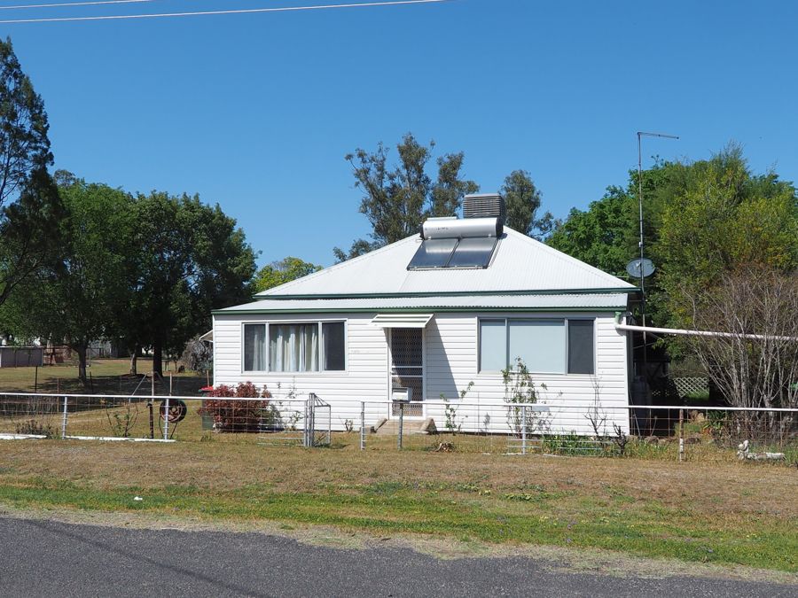 COMFORTABLE FOUR-BEDROOM HOME ON LARGE BLOCK