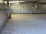 STORAGE DOUBLE GARAGE FOR LEASE WITH CONCRETE FLOOR AND POWER