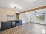 STYLISH, LOW-MAINTENANCE LIVING IN A PRIME LOCATION