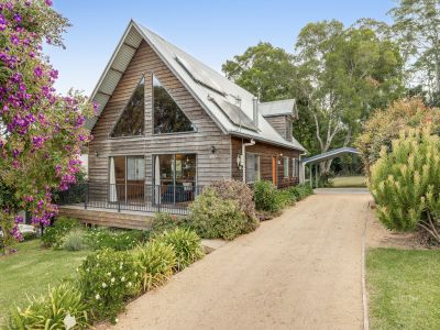 STORYBOOK CHARM MEETS MODERN COMFORT IN A PEACEFUL GATED COMMUNITY