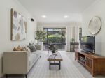 LOW-MAINTENANCE LIVING, STEPS FROM THE BEACH AT AN UNBEATABLE PRICE!