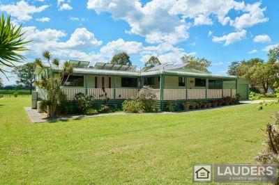 ENJOY ACREAGE LIVING ON THE COAST