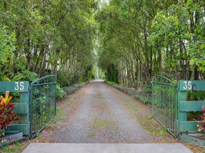 PRIVATE ACREAGE RETREAT WITH MODERN UPDATES & EXCEPTIONAL ENTERTAINING