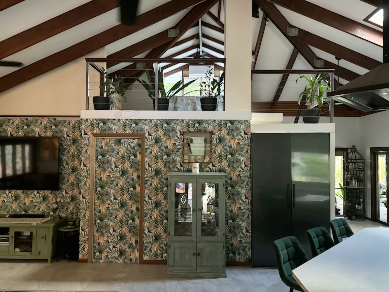 Soaring ceilings, exposed timber boards and a spla