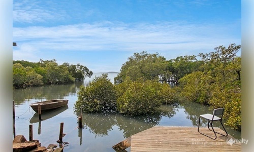 ARCHITECTURALLY DESIGNED WATERFRONT SANCTUARY WITH PRIVATE WATER ACCESS.