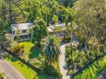 PEACEFUL ELEVATED  SETTING WITH TWO HOMES ON OVER 1/2 ACRE