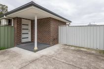 GREAT LOCATION WITH CARPORT!