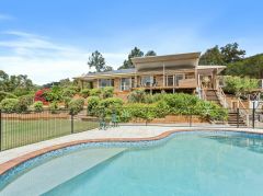 A PRIVATE ACREAGE SANCTUARY WITH SWEEPING GOLD COAST SKYLINE VIEWS