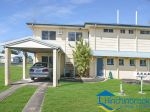 TWO BEDROOM UNIT WITH AIR CONDITIONING & 2-BAY CARPORT