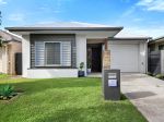 VERSATILE FAMILY HOME WITH MEDIA ROOM & DRIVE-THROUGH ACCESS.