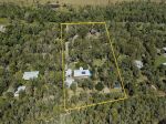 PRIVATE ACREAGE RETREAT JUST MINUTES FROM THE BEACH