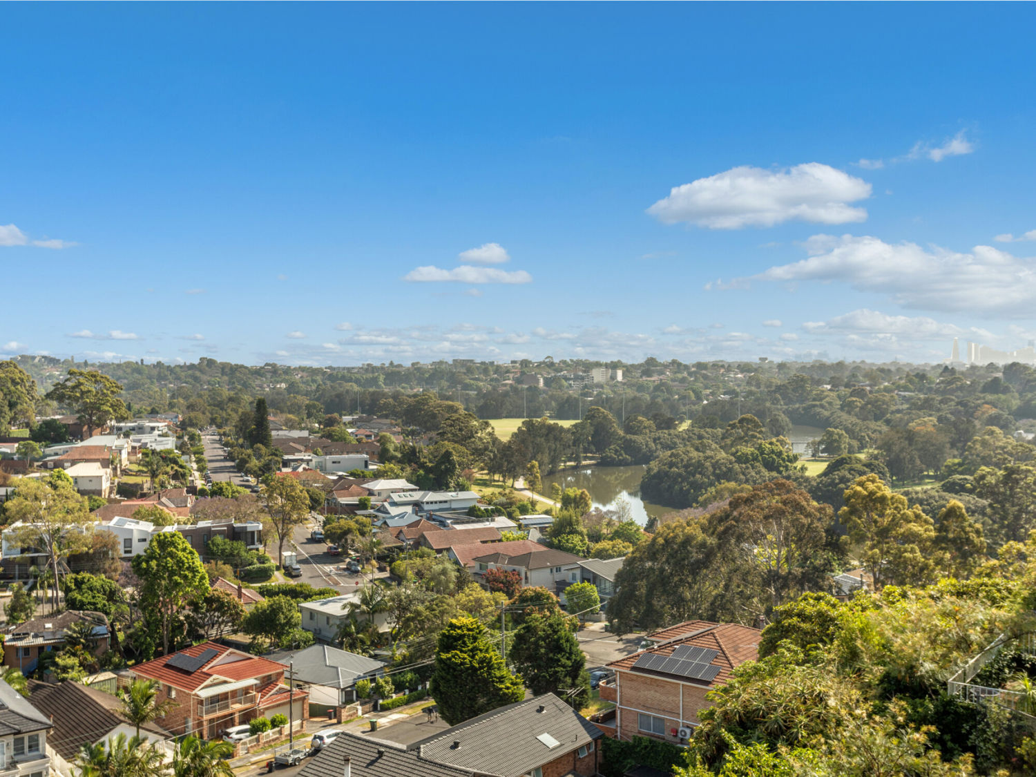 LIGHT-FILLED APARTMENT WITH DISTRICT VIEWS, PRIVACY & EXCITING RENOVATION POTENTIAL